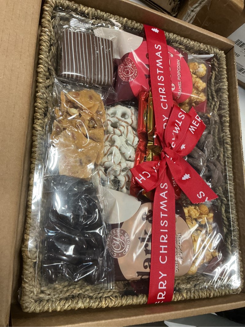 (best if used by 08/25/2026)a gift inside merry christmas chocolate caramel and crunch grand gift basket