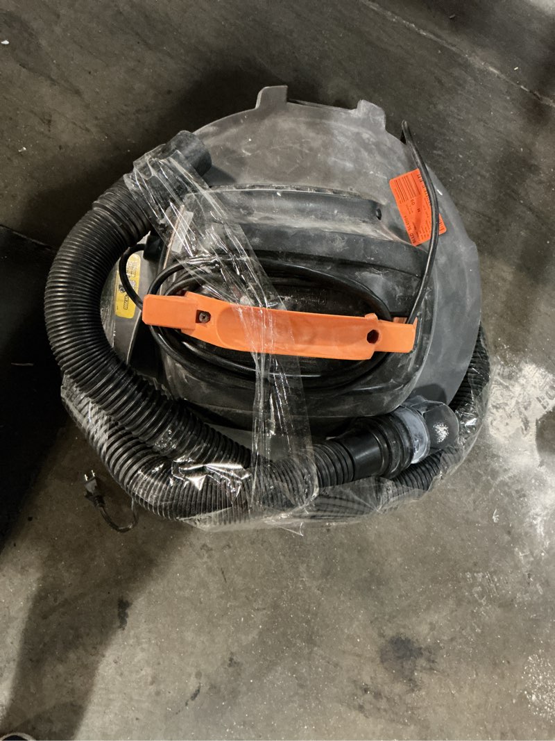 Condition photo showing As Is for 12 gal. 5.0-peak hp wet dry vac