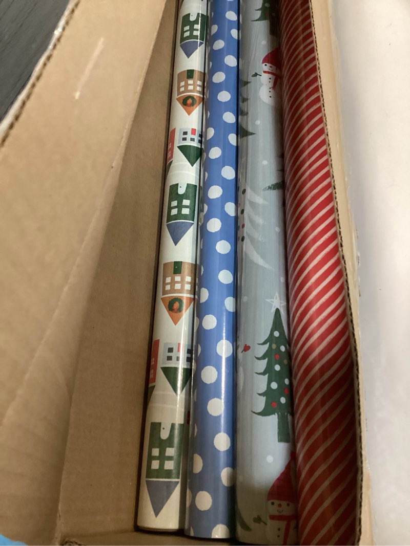 Condition photo showing Good Condition for ( incomplete) Hallmark Cute Recyclable Christmas Wrapping Paper (6 Rolls: 180 Sq. Ft. Total) Red, Blue, Green Plaid, Merry Everything, Colorful Houses, Snowmen and Trees, Dots, Stripes Cute Christmas
