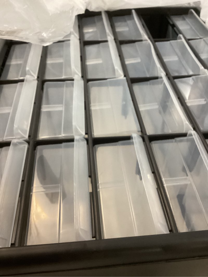 Condition photo showing Good Condition for akro-mils 24-drawer plastic drawer storage cabinet for garage organization, bead organizer, building bricks storage, teacher toolbox, makeup organizer, 20" w x 6" d x 16" h, 10124 black black 24 drawer 1 pack