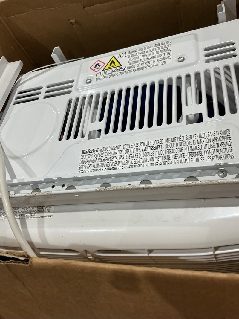 Condition photo showing As Is for frigidaire 5,000 btu window-mounted air conditioner, cools up to 150 sq. ft., quiet operation, effortless temperature control, 2 fan speeds, auto restart, white 5,000 btu mechanical controls