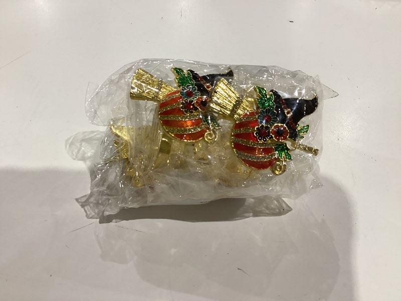 Condition photo showing New/Like New for Garneck 4Pcs Halloween Napkin Rings Holder Pumpkin with Witch Hat Broom Napkin Buckle Metal Witch Serviette Buckles for Halloween Table Decorations 5.30X4.50X4.00CM