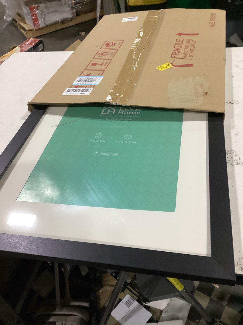 Condition photo showing As Is for lavie home 18x24 picture frame black poster frame, display pictures 16x20 with mat or 18x24 without mat, stable and sturdy frame and polished plexiglass, horizontal and vertical format of the walls 18x24 black