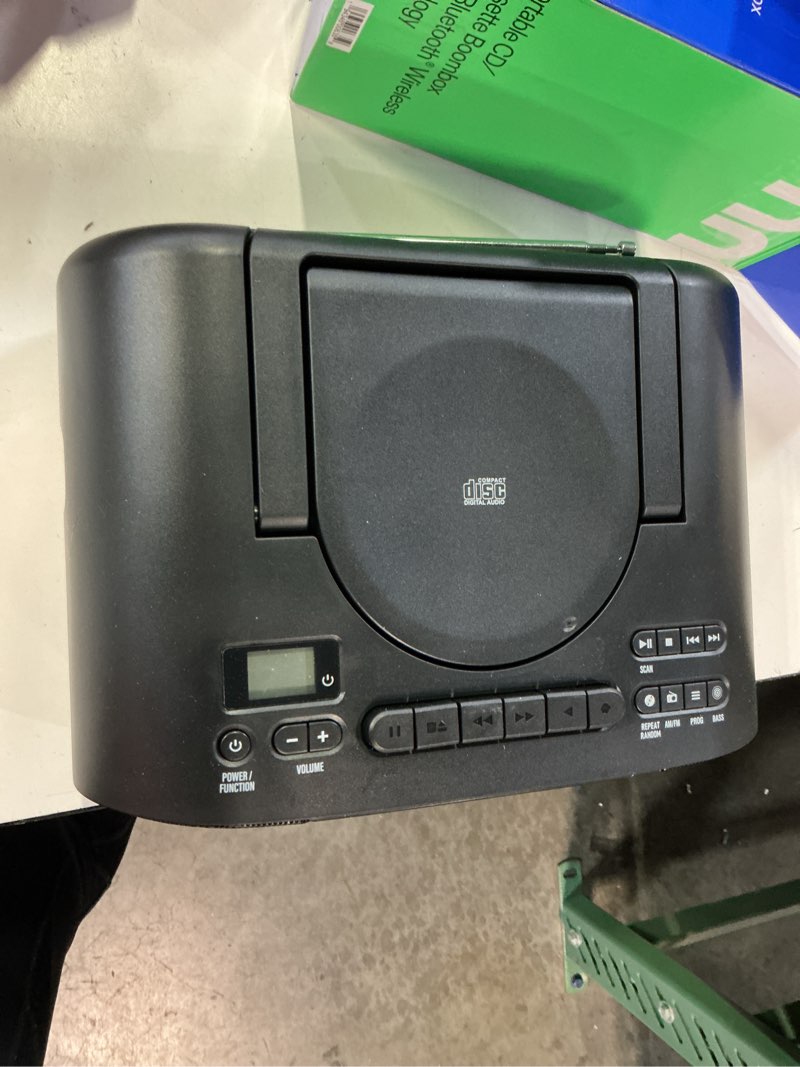 Condition photo showing As Is for onn cassette boombox with bluetooth, cd, mp3 and radio features