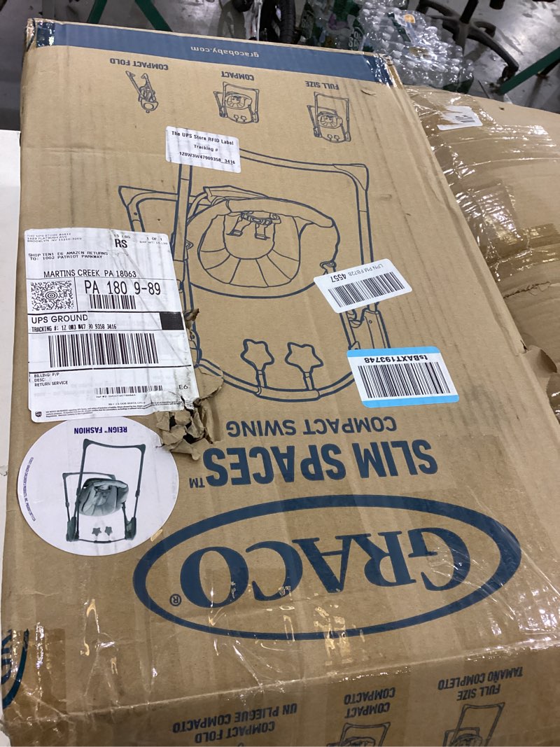 Condition photo showing As Is for Graco Slim Spaces Compact Baby Swing, Space Saving Portable Bay Swing with Height Adjustable Legs & Soft Toys, Reign