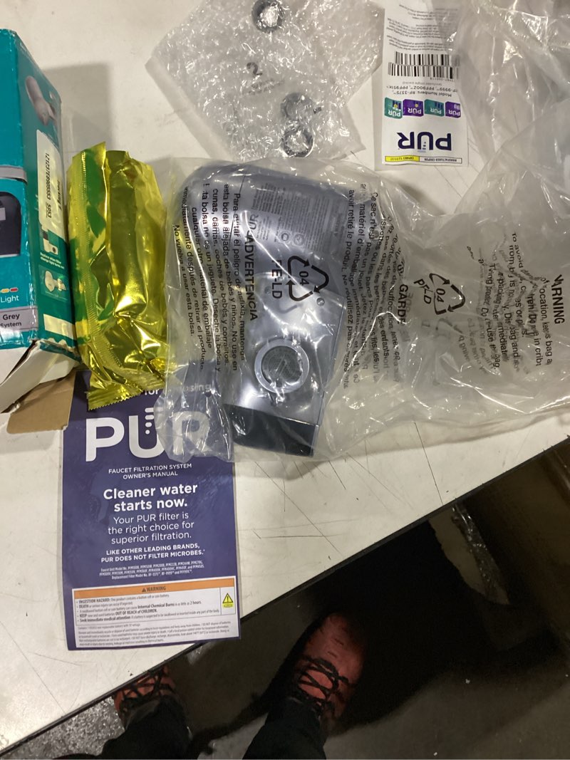 Condition photo showing As Is for pur plus horizontal faucet mount filtration system with 3-in-1 lead reducing filter, water filter for sink, lasts 100 gallons, compatible with sinks with external aerators, metallic grey