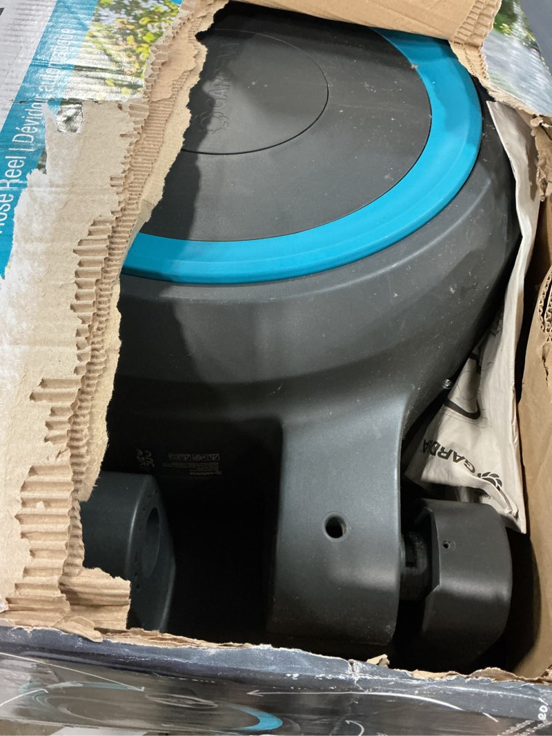 Condition photo showing As Is for gardena retractable garden hose reel - 115 feet - auto retract hose reel with 180° swivel wall mount - heavy duty - integrated spray nozzle - 18630 115 ft
