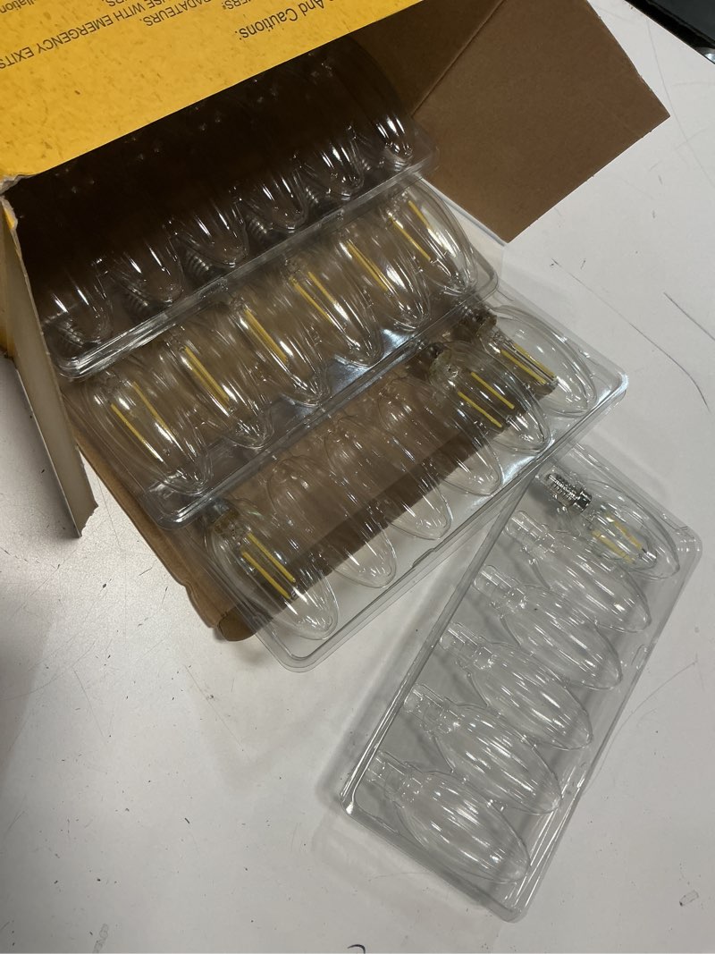 Condition photo showing As Is for ascher e12 led classic candelabra clear light bulbs 4w, equivalent 40w, daylight white 5000k, non-dimmable, filament clear glass, pack of 24 daylight white(40w) 24 count(pack of 1)