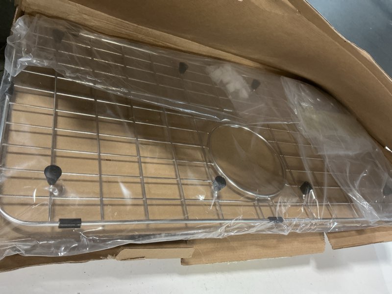 Condition photo showing New/Like New for Serene Valley 25-1/4" X 12-1/2“ Sink Grid, Rear Drain with Corner Radius 1-1/2", NLW2513R