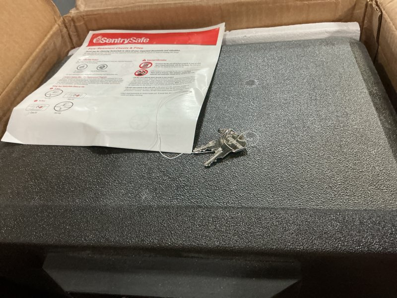 Condition photo showing As Is for SentrySafe Black Fireproof Document Box with Key Lock, Safe Secures Files and Documents for Home or Office, 0.61 Cubic Feet, 13.6 x 15.3 x 12.1 inches, 1170