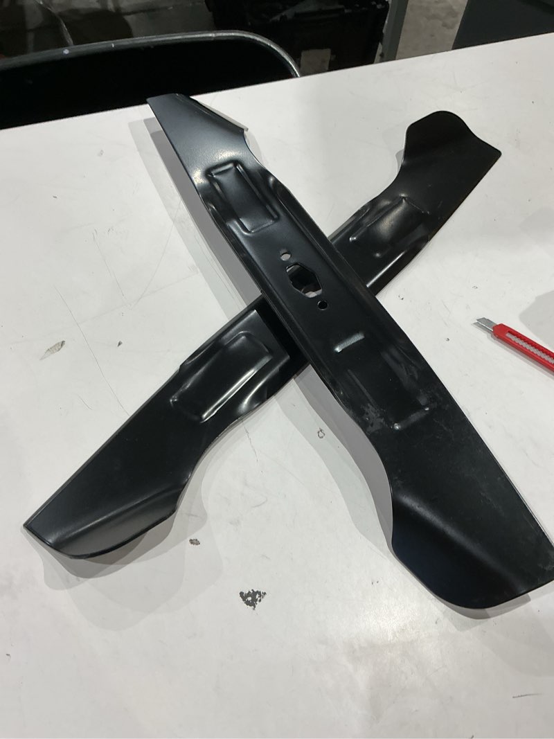 Condition photo showing As Is for 2 piece black lawnmower blades