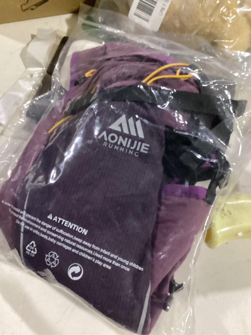 Condition photo showing Good Condition for aonijie running hydration vest for men & women, 8l hydration backpack, multiple pocket designs for water bottles/bladders, lightweight breathable for hiking, climbing, marathon & cycling 8l purple