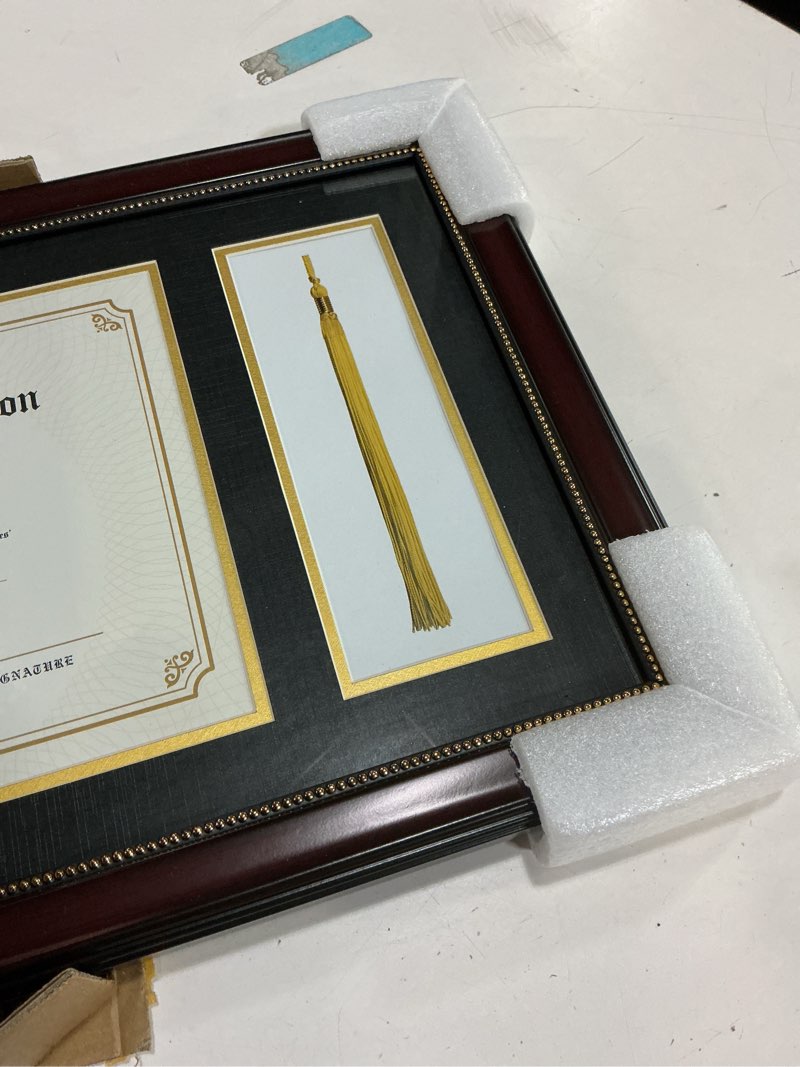 Condition photo showing Good Condition for GraduatePro 11x17 Diploma Frame with Tassel Holder for 8.5x11 Certificate Graduation Gifts, Mahogany Gold Rim with Double Mat Black Over Gold, Real Glass Mahogany Frame - Black Over Gold 11x17