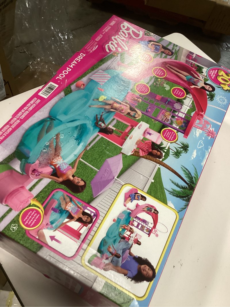 Condition photo showing New/Like New for barbie dream pool playset with 6 play areas, including slide & bubbling hot tub, plus 20+ accessories like pet, floaties & more