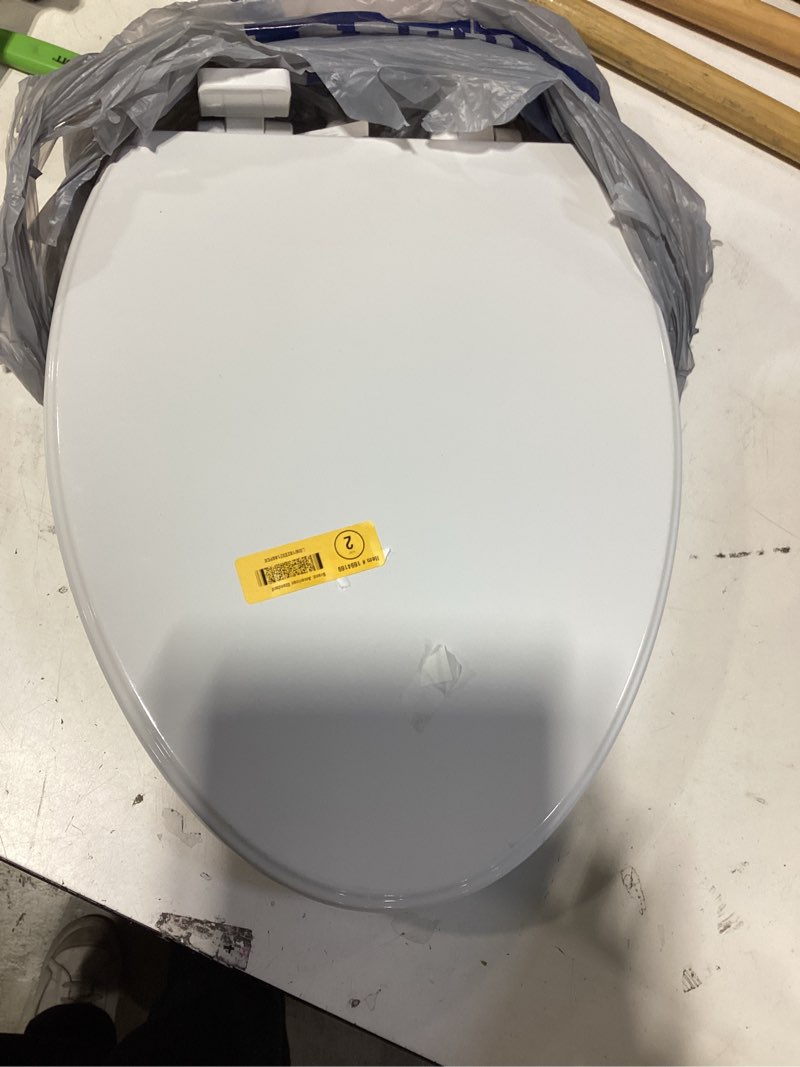 Condition photo showing As Is for american standard moments wood white elongated soft close toilet seat