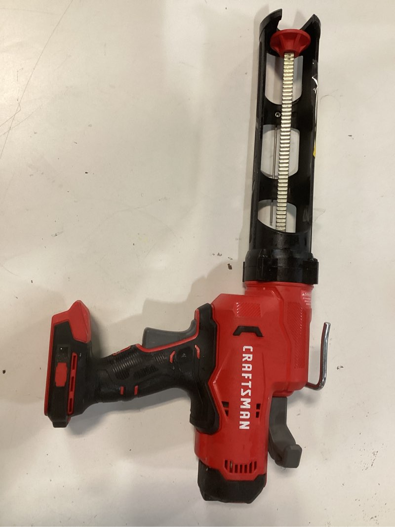 Condition photo showing As Is for craftsman caulking gun