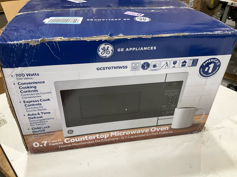 Condition photo showing New/Like New for GE Compact Countertop Microwave Oven, 0.7 Cubic Ft., 700-watt Capacity, 6 Auto Cooking Settings, Child-Lock Technology, Dorm Room or Apartment, Stainless Steel 0.7 Cu.Ft. Stainless Steel