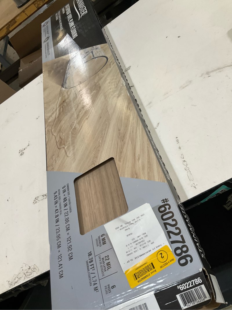 Condition photo showing As Is for stainmaster carrboro oak brown wood look 22-mil x 9-in w x 47-in l waterproof and water resistant interlocking luxury vinyl plank flooring ( 18.78-sq ft carton )
