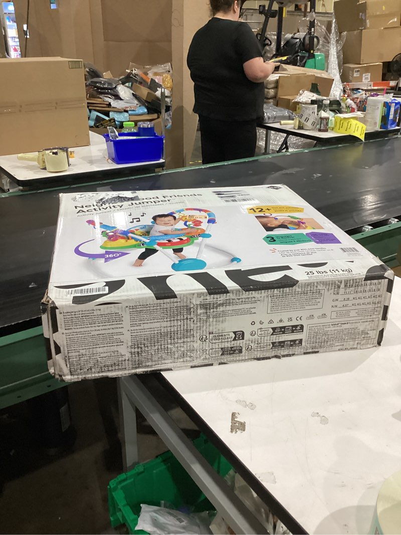 Condition photo showing New/Like New for Baby Einstein Neighborhood Friends Activity Jumper with Lights and Music, 6 Months+, Max Weight 25lbs., Unisex