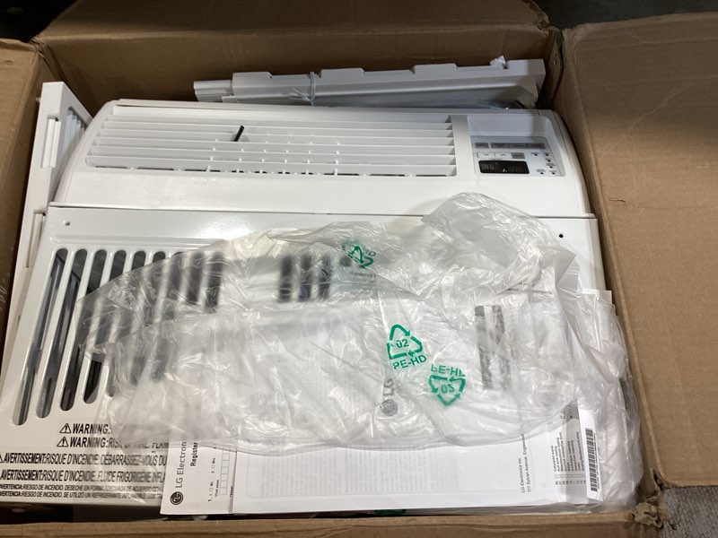 Condition photo showing Good Condition for lg 6,000 btu window air conditioner, 115v, cools 250 sq.ft. for bedroom, den, living room, quiet operation, with remote, 2 cooling & fan speeds, 2-way air deflection, auto restart, white 6000 btu electronic & standard white