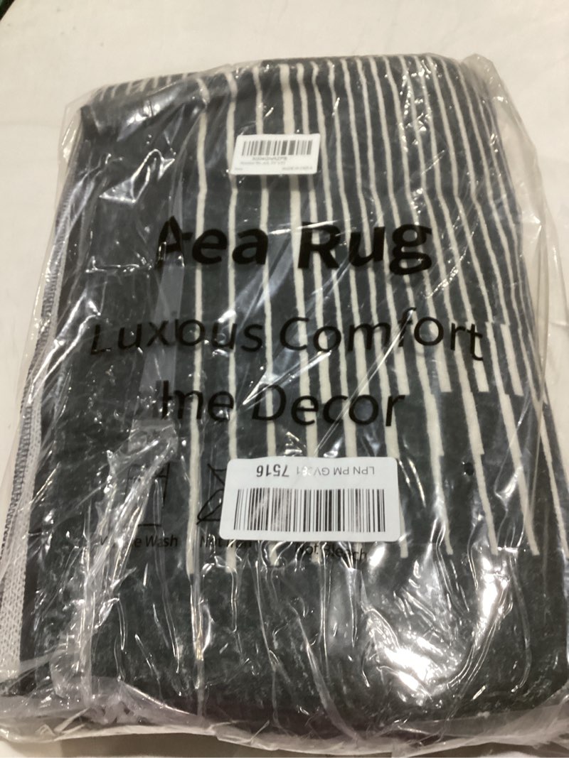 Condition photo showing Good Condition for wonnitar washable striped black runner rug for hallway 2'6"x8', non-slip kitchen runner rug, low pile minimalist soft rug runner for bedroom hallway bathroom laundry entryway (black, 2'6" x 8') 2'6" x 8' (rectangular) black