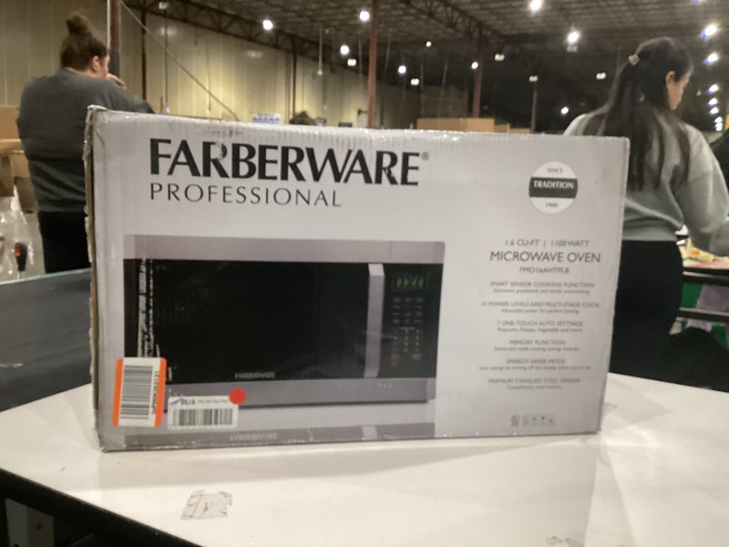 Condition photo showing Good Condition for Farberware 1.6 Cu. Ft. Countertop Microwave Oven – 1100 Watts Power, Smart Sensor Auto Cook Settings, Defrost, Easy Clean and Child Safety Lock - Stainless 1.6 Cu. Ft. Stainless Steel