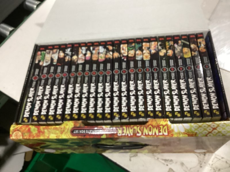 Condition photo showing New/Like New for a libray of damon slay manga toy reading 1-23 complete box set volumes