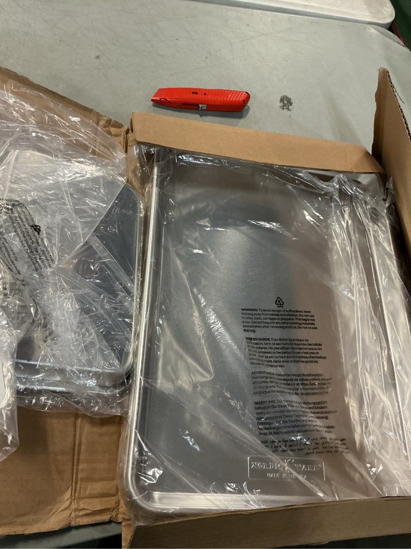 Condition photo showing Good Condition for Nordic Ware Naturals Half Sheet Set - USA Made Aluminum Commercial Quality Sheet Pan for Baking or Roasting, Encapsulated Galvanized Steel Rim Prevents Warping, 2pk Half + 1/8 Sheet