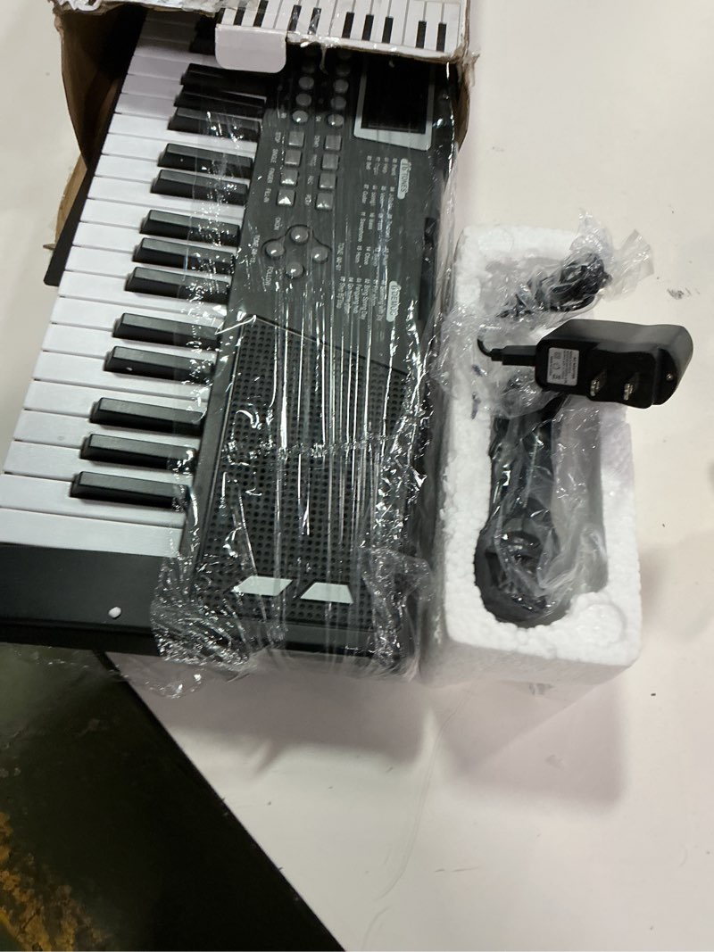 Condition photo showing Good Condition for 61 key piano keyboard?keyboards piano with Built-In Speaker Microphone, Sheet Music Stand and Power Supply, Portable Electronic Keyboard Piano for Beginners