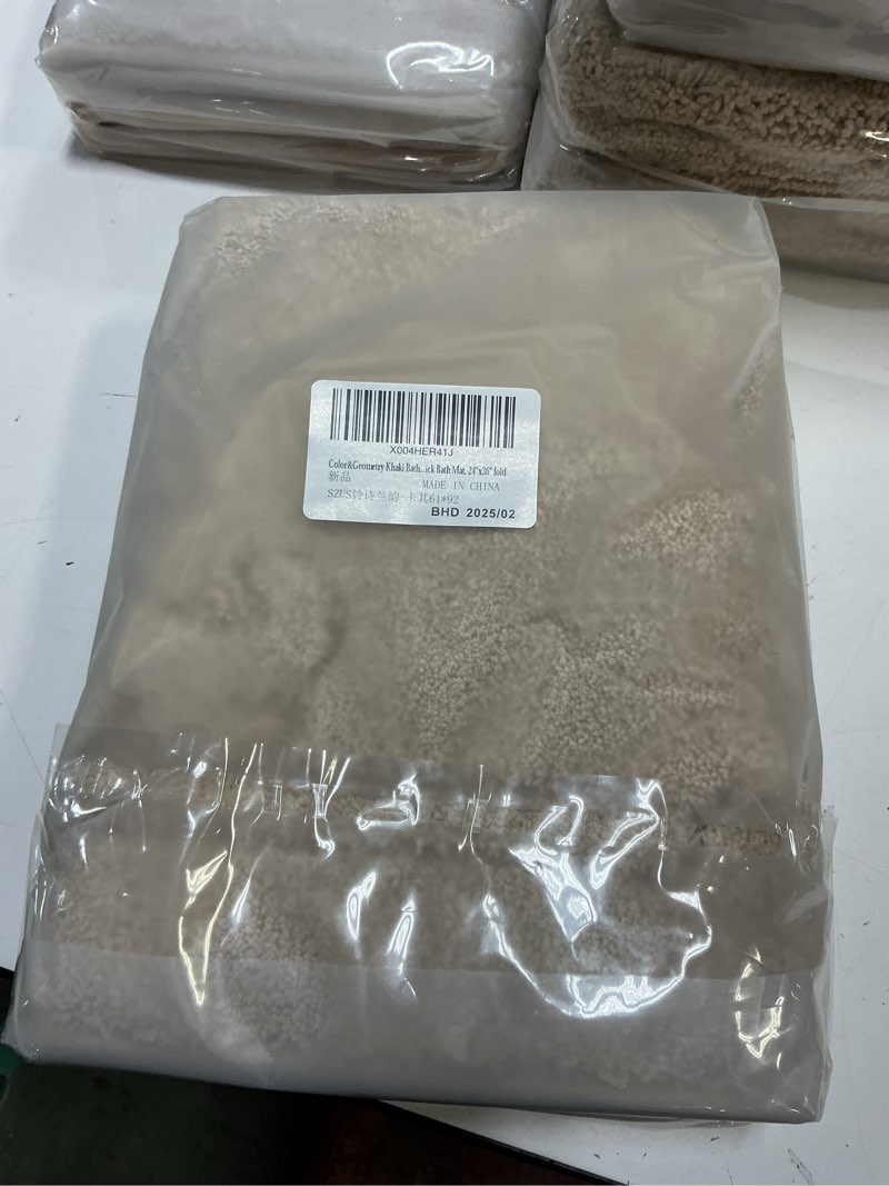 Condition photo showing New/Like New for Color&Geometry Non Slip Washable Bath Mat 17"x30", Soft and Super Absorbent Shower Mats Quick Drying Rug, Cushioned Shower Rug for Bathroom Floor, Bathtub, Laundry Room, Khaki Khaki [17"x30"]