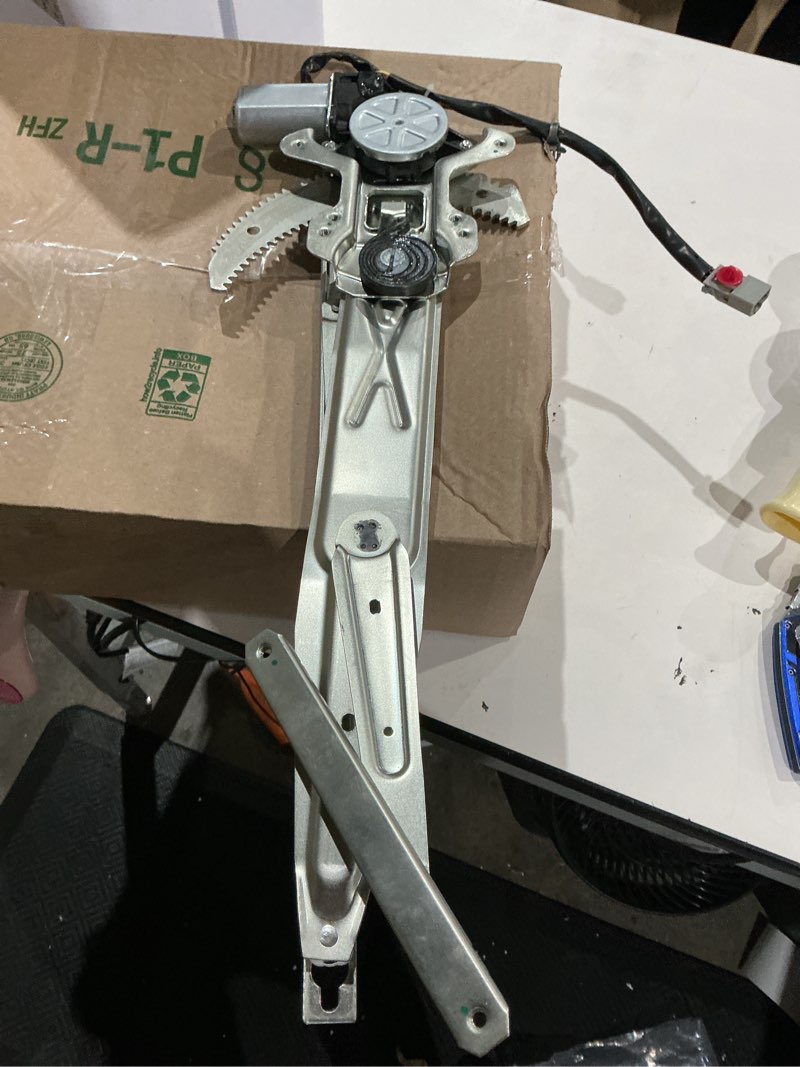 Condition photo showing As Is for front passenger side power window regulator with motor ...
