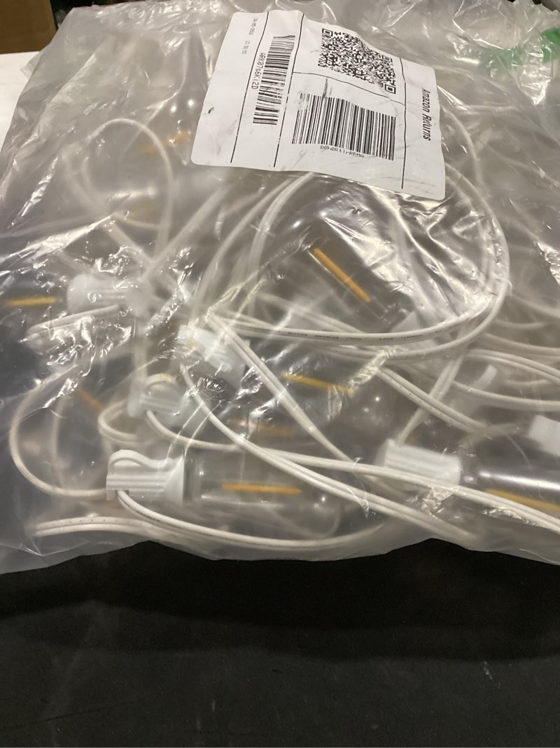 Condition photo showing As Is for brightever led outdoor string lights,100ft patio lights with 52 shatterproof st38 vintage edison bulbs 2700k dimmable, outside hanging light waterproof for porch deck, garden, backyard, balcony white white wire 100ft-warm white