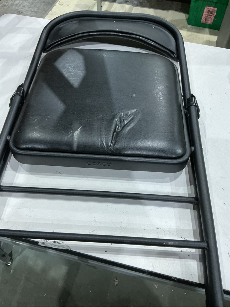 Condition photo showing As Is for cosco indoor black metal steel padded vinyl standard folding chair