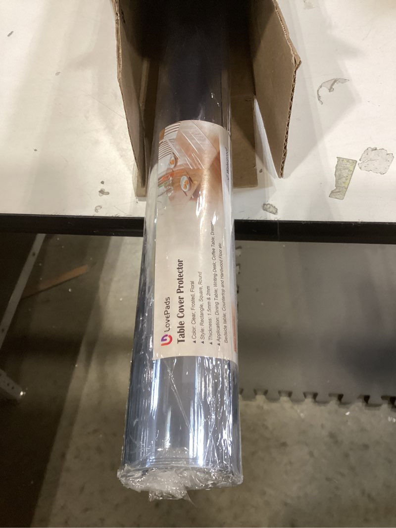 Condition photo showing New/Like New for LovePads Clear Table Cover Protector 42 x 63 Inch, 1.5mm Thick Plastic Table Cover, Table Protector for Dining Room Table, Waterproof Vinyl Tablecloth Table Pad Mat for Kitchen, Dresser, Writing Desk 42" x 63" Clear 1.5mm