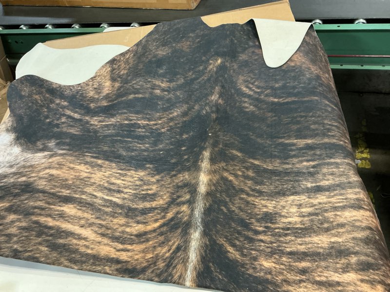 Condition photo showing Good Condition for Sunshine Cowhides 100% Genuine Dark Brindle Cowhide Rug - Modern Style Animal Skin Rug & Floor Carpet for Living Room, Bedroom, Kitchen & More - Extra Large (6x7-8 Ft.) 7' x 6' (Animal Shape)