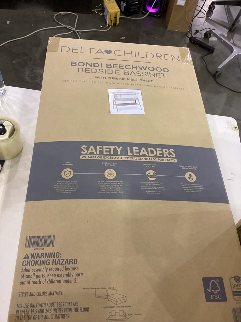 Condition photo showing New/Like New for Delta Children Bondi Adjustable Height Bedside Beechwood Bassinet with PureAir Mesh Sheet and FSC-Certified Wood, Tan Bedside Bassinet