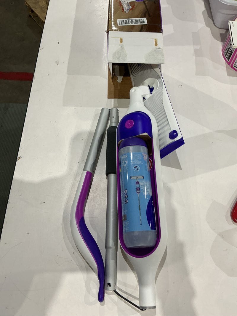 Condition photo showing As Is for swiffer powermop multi-surface mop kit for floor cleaning, includes powermop, 2 mopping pad refills, 1 cleaning solution with fresh scent and 2 batteries purple and white
