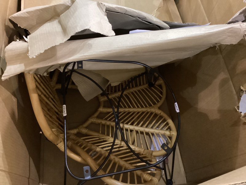 Condition photo showing As Is for Baxton Studio Garan Modern Bohemian Brown Rattan and Black Metal Accent Chair