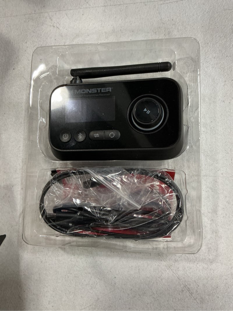 Condition photo showing As Is for monster bluetooth transmitter & receiver, 2-in-1 bluetooth audio adapter, stream to/from nonbluetooth devices, stream tv to 2 headphones, 33 ft range, analog & digital, tv usb powered, 3.5mm aux port