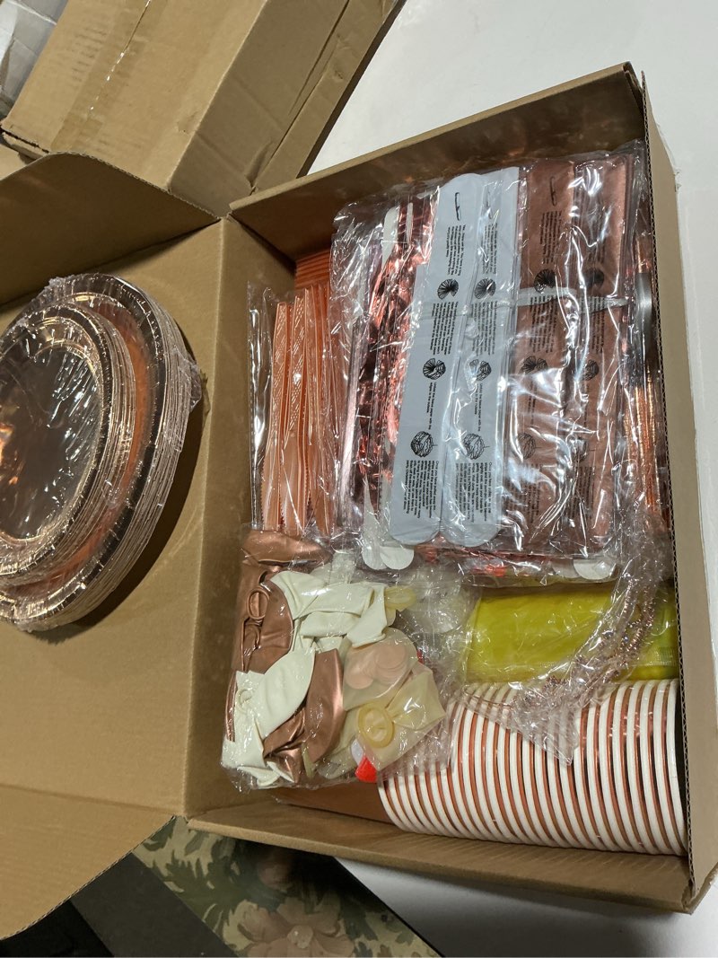 Condition photo showing Good Condition for 285 Pcs Rose Gold Party Decorations, Birthday Decorations For Women Or Girl - Knives, Forks and Spoons, Tiara, Butterfly, Sash, Paper Pom Poms, Balloon Stand, Tableware For 25 Guests