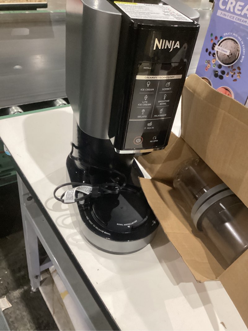 Condition photo showing As Is for incomplete )))ninja nc301 creami ice cream maker, for gelato, mix-ins, milkshakes, sorbet, smoothie bowls & more, 7 one-touch programs, with (2) pint containers & lids, compact size, perfect for kids, silver