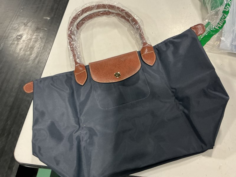 Condition photo showing Good Condition for le pliage-inspired astral blue nylon tote 12”medium packable long handles
