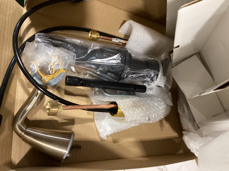 Condition photo showing As Is for delta arvo brushed gold faucet 3 hole, 8 inch widespread bathroom sink faucet for vanity, push-pop drain assembly, champagne bronze 35840lf-cz champagne bronze standard spout