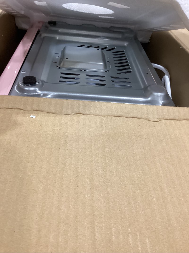 Condition photo showing As Is for Nostalgia Retro Microwave Oven - 0.7 Cu Ft, 700-Watt Countertop Size with Glass Turntable, Child Safety Lock, 8 Auto-Cook Programs, Digital Clock - Pink 0.7 Cu. Ft. Pink