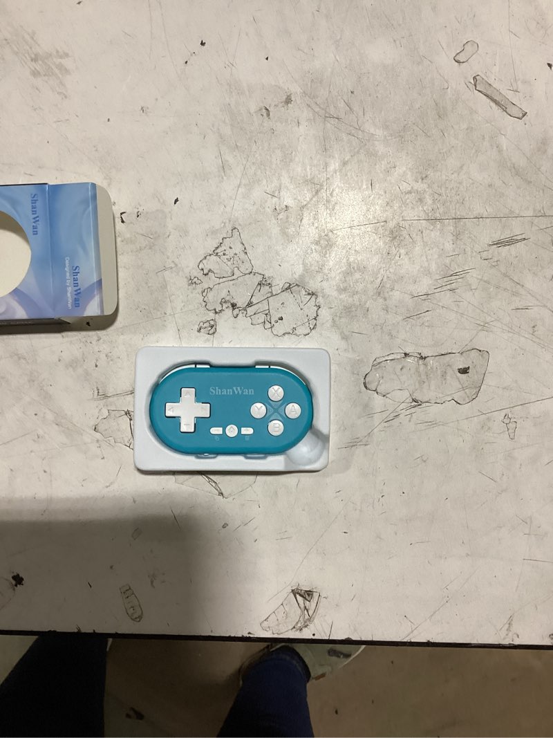Condition photo showing As Is for shanwan bluetooth gamepad keychain sized mini controller for switch, windows, android, ios & ps4?kabrilan?