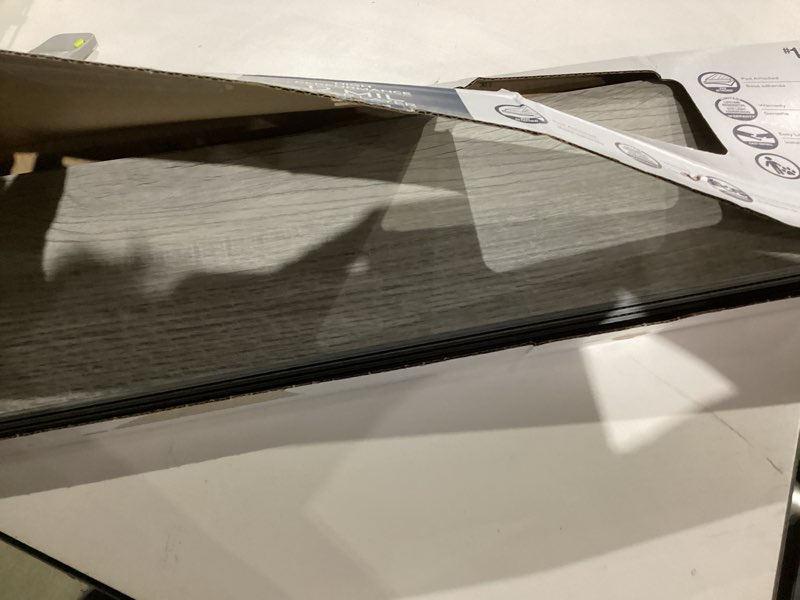 Condition photo showing As Is for waterproof luxury vinyl plank flooring 