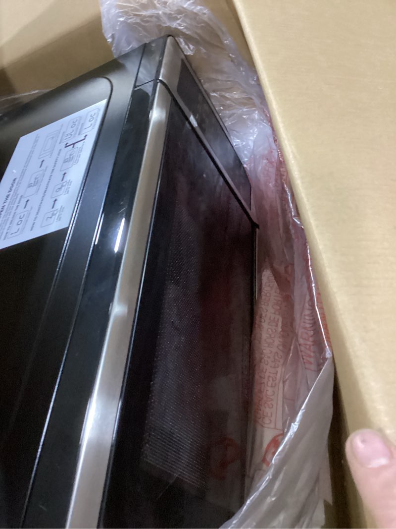 Condition photo showing New/Like New for BLACK+DECKER EM720CB7 Digital Microwave Oven with Turntable Push-Button Door, Child Safety Lock, 700W, Stainless Steel, 0.7 Cu.ft 0.7 cu. ft.