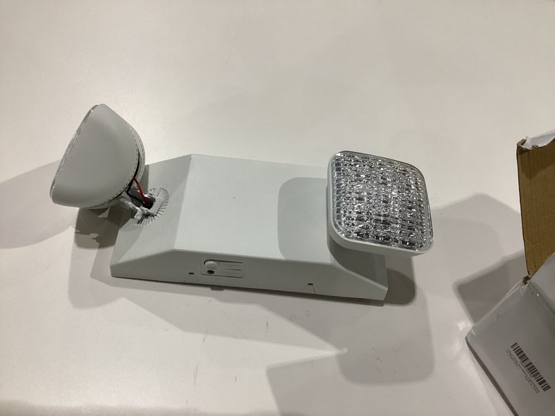 Condition photo showing As Is for TANLUX LED Emergency Lights with Battery Backup, Two Head Adjustable Commercial Emergency Lights, UL Listed, AC 120/277V, Hardwired Emergency Exit Light Fixtures for Business - 1 Pack(White) 1 Pack White