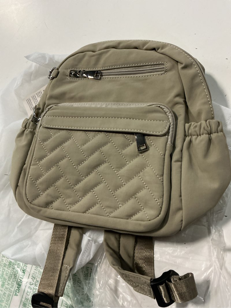 Condition photo showing Good Condition for sytrah anti-theft backpack for women, waterproof puffer travel backpack with locking zippers & coin purse, compact quilted daypack for work, commuting & airport, stylish & lightweight khaki