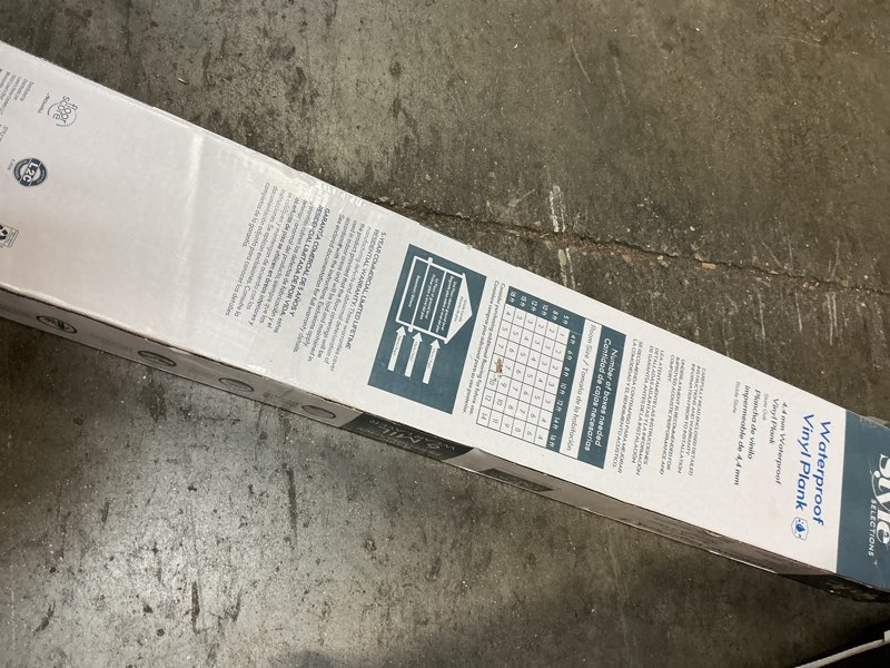Condition photo showing As Is for style selections slate oak gray 6-mil x 6-in w x 36-in l waterproof interlocking luxury vinyl plank flooring (22.17-sq ft/ carton)